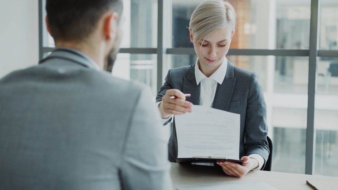 Immigration consultant reviewing documents with client